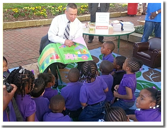 Commissioner Tony Bennett reads to a group of children at the capitol