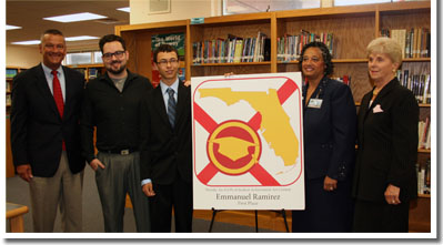 Deltona High School student Emmanuel Ramirez (center) with Commissioner Dr. Tony Bennett