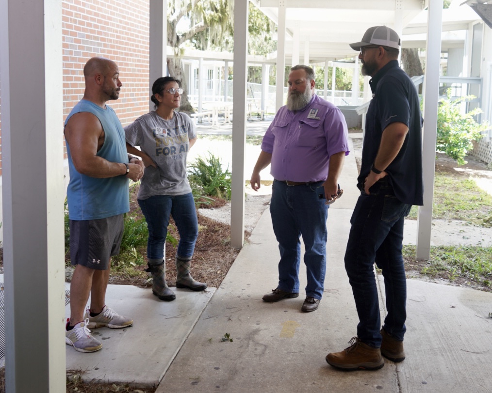 Commissioner Diaz and Levy County Superintendent Christopher Cowart meet with Principal Slemp of Cedar Key School.